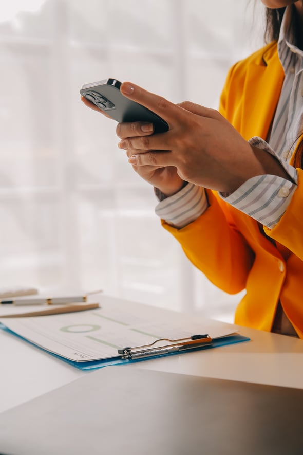 business-woman-using-mobile-phone-working-laptop-computer-surfing-internet-searching-business-data-modern-office-asian-businesswoman-online-working-computer-workplace